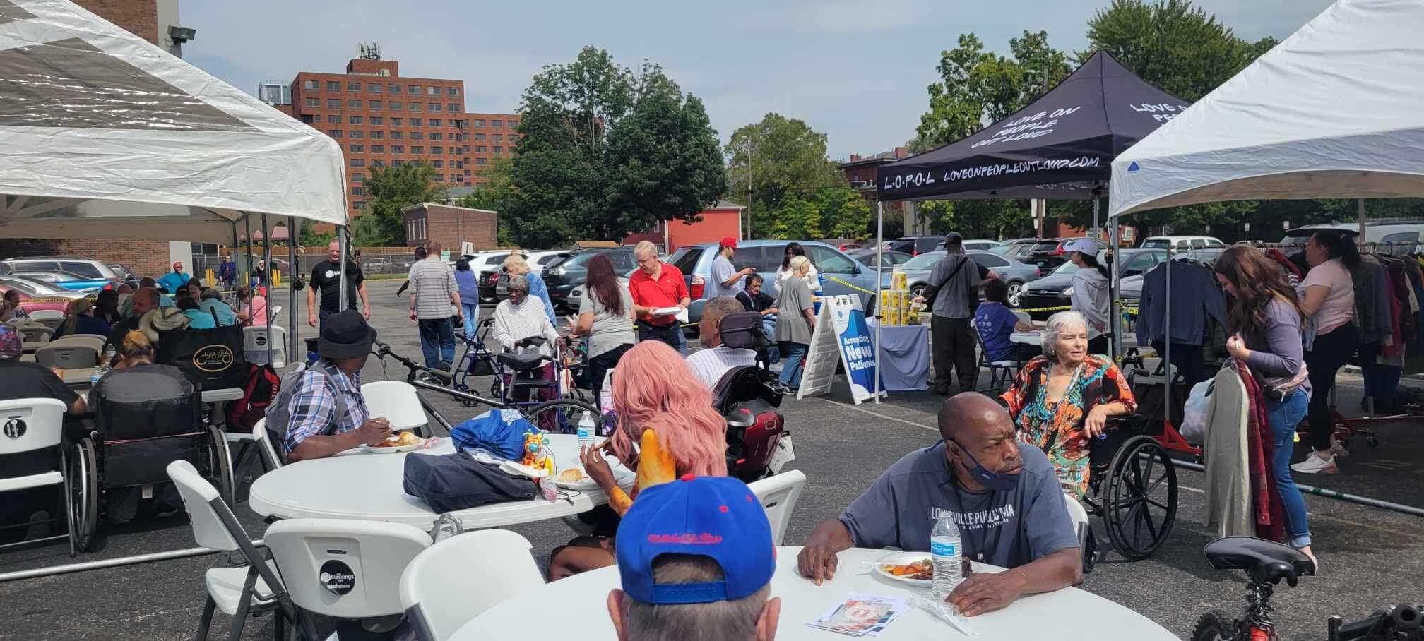 Louisville nonprofit provides free food, clothes to those in need at monthly events across the city